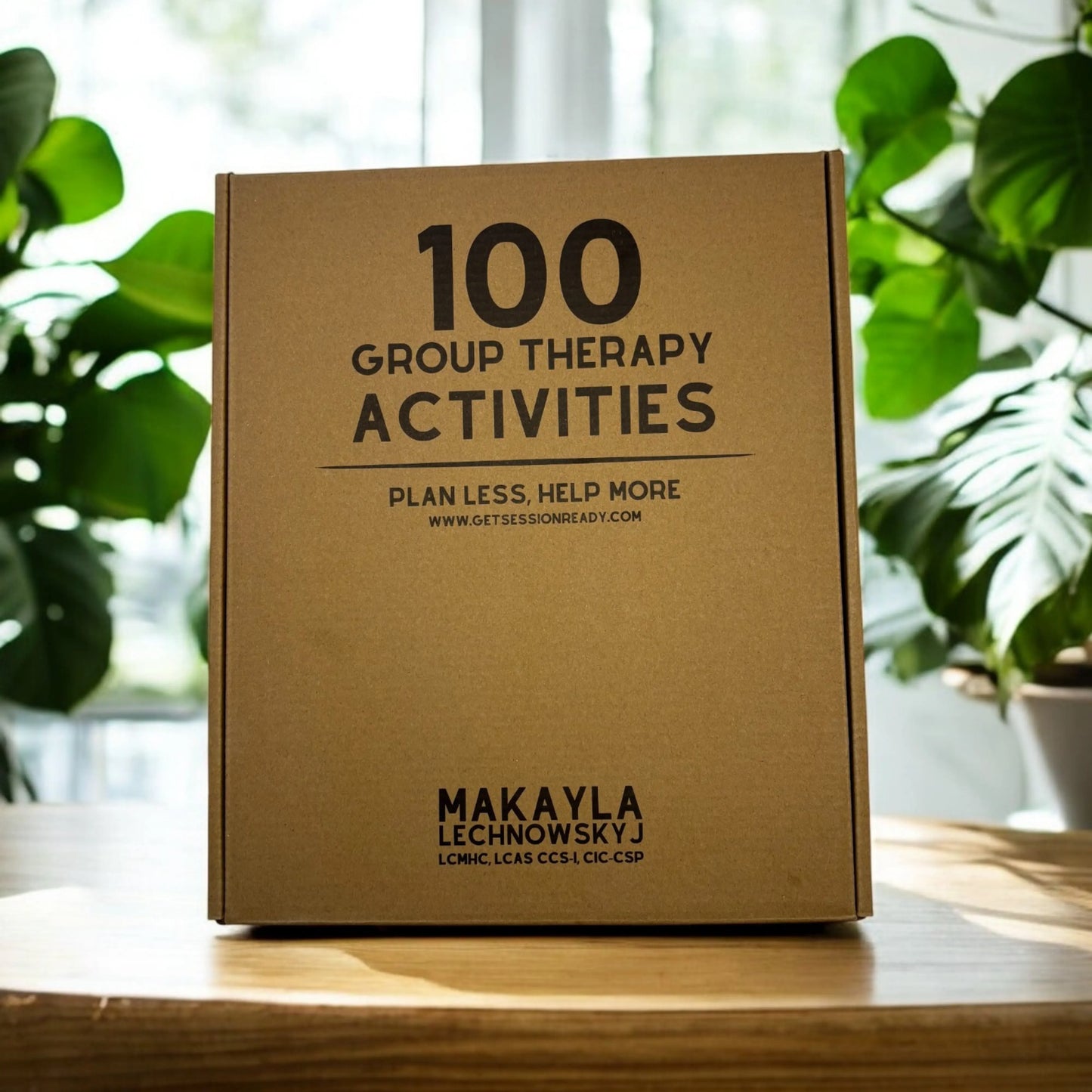 The eco-friendly branded shipping box for 100 Group Therapy Activities, printed with the text "PLAN LESS, HELP MORE" and the author's name "Makayla Lechnowskyj".